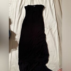 Black tight fitting SHEIN dress with leg slit